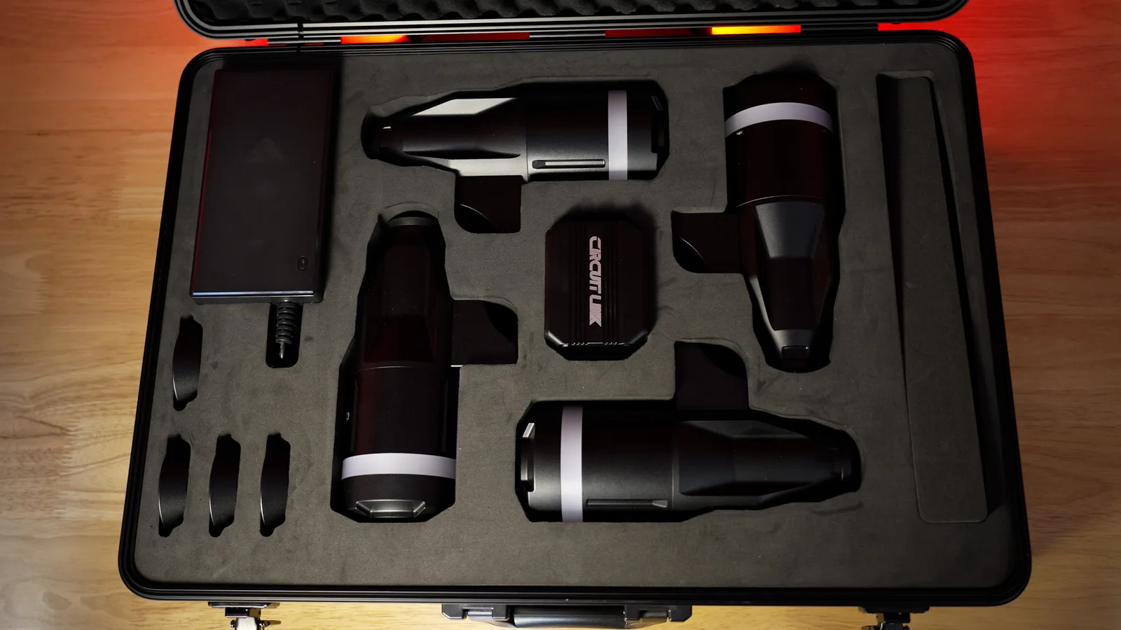 The open Circuit One case: four actuators, the LINK box, power supply and base cups in cut foam