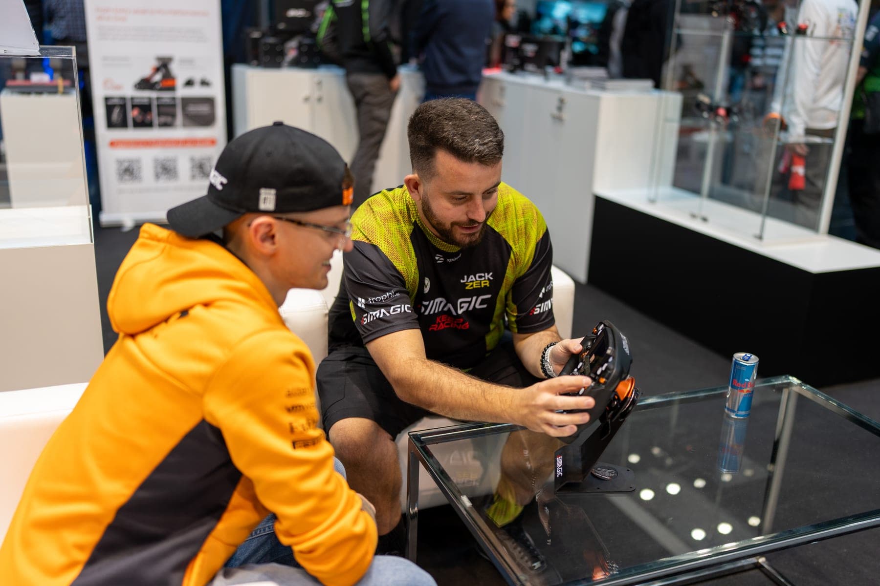 Showing the SIMAGIC Zeus wheel to a young racer